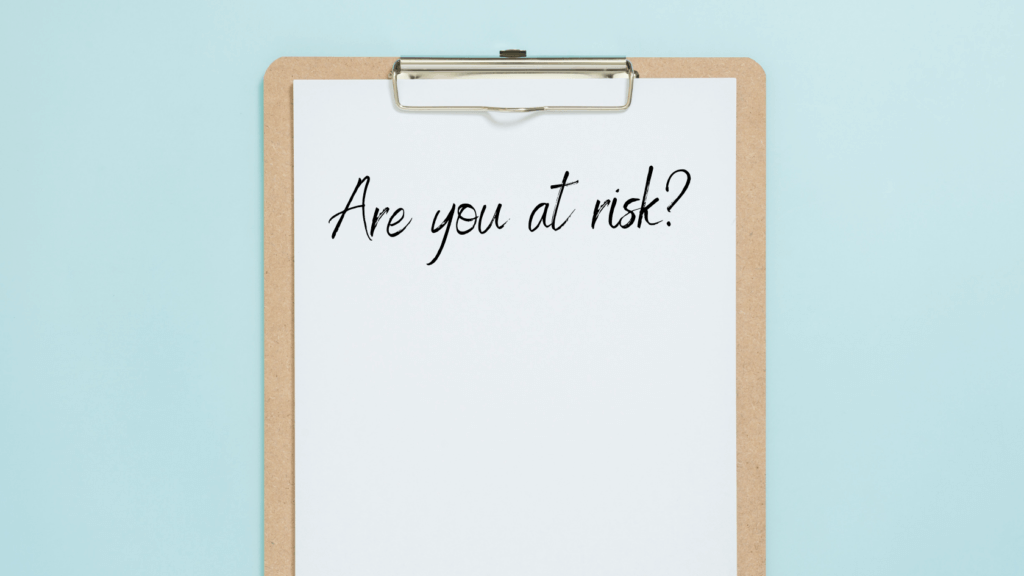 A clipboard with "Are you at Risk" written on it.