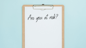 A clipboard with "Are you at Risk" written on it.