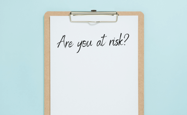 A clipboard with "Are you at Risk" written on it.