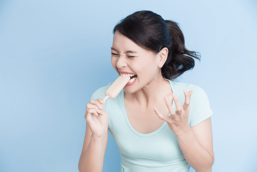 woman eating a popsicle