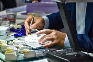 person working on dental crowns