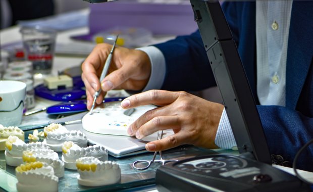 person working on dental crowns